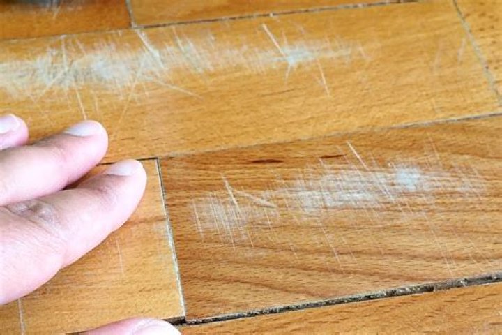 How do you repair scratches in hardwood floors?